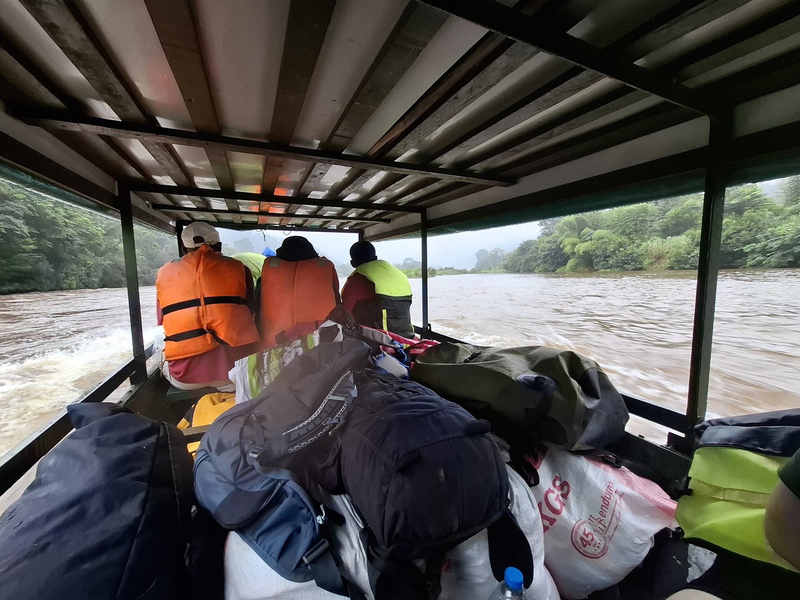 Traveling by boat up a swollen river
